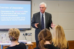 Richard Mitchell providing EMDR training to a small group of people.